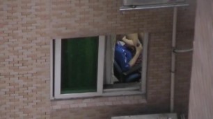 Horny Chinese gets caught wanking from window